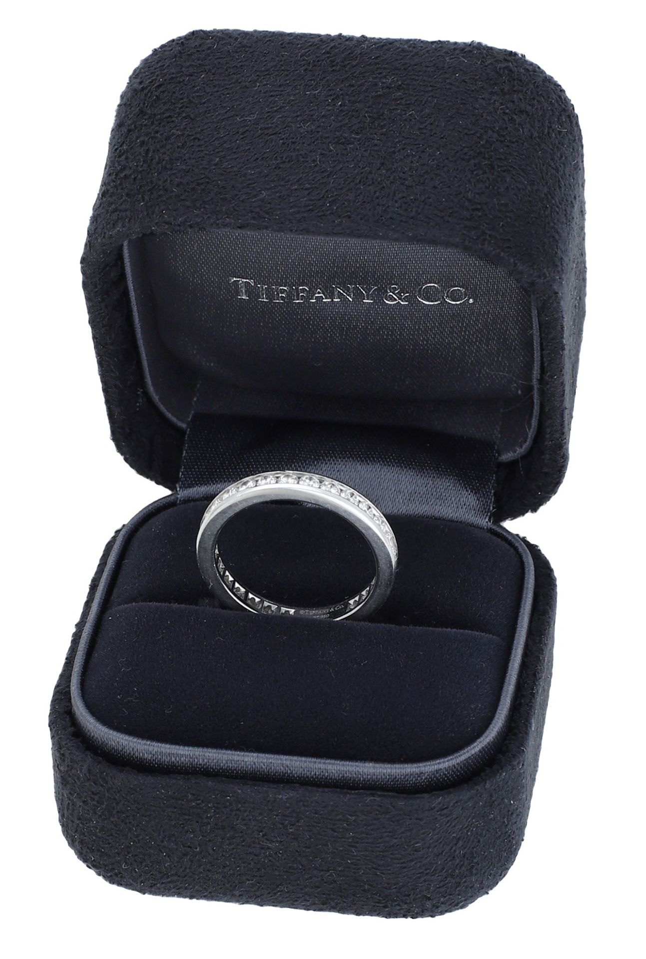 A platinum and diamond eternity ring by Tiffany & Co., channel-set throughout with brilliant...