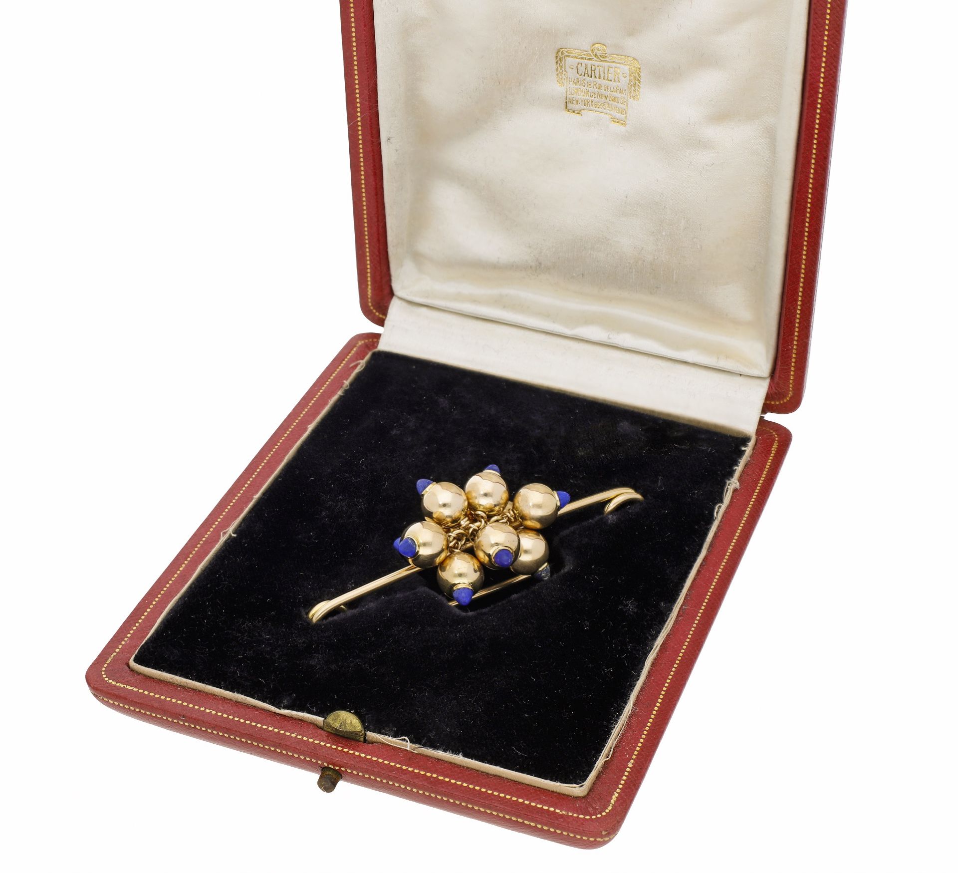 A gold and lapis lazuli pin brooch by Cartier, circa 1940, centred with a cluster of indivi...