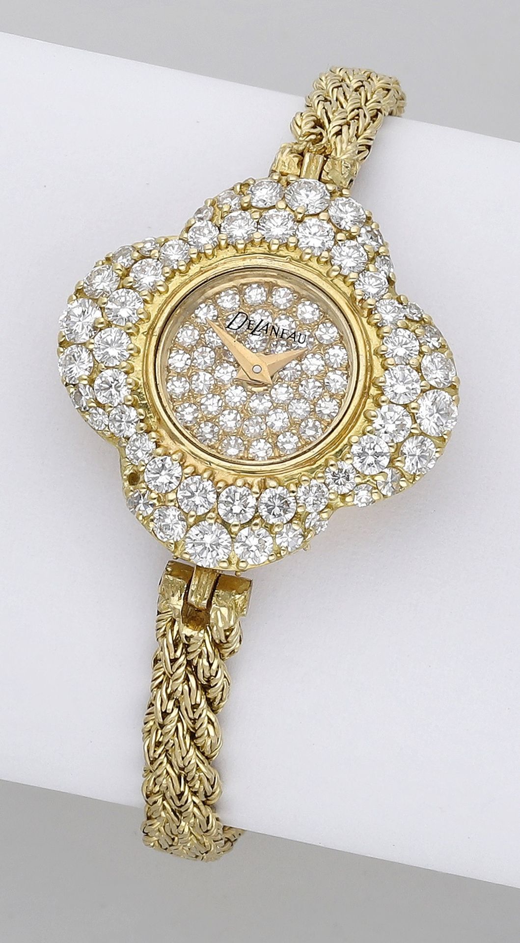 De Laneau. Retailed by Kutchinsky. A lady's gold and diamond-set bracelet watch, Ref. 11072/...