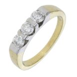 A three stone diamond ring, the three brilliant-cut diamonds tension-set to a tapered band,...