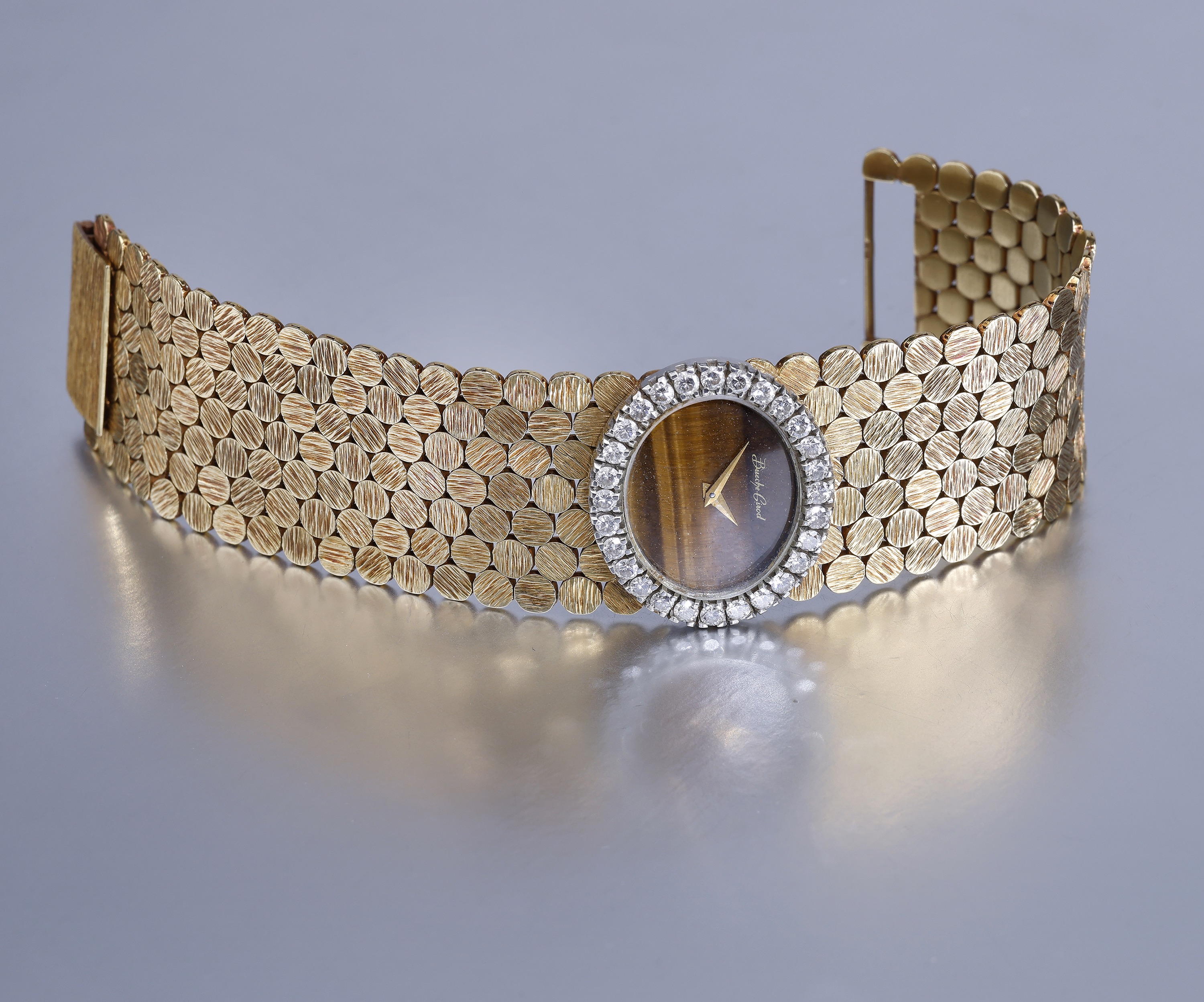 Bueche Girod. A gold and diamond-set bracelet watch with tiger's eye dial, circa 1971. Move... - Image 5 of 6