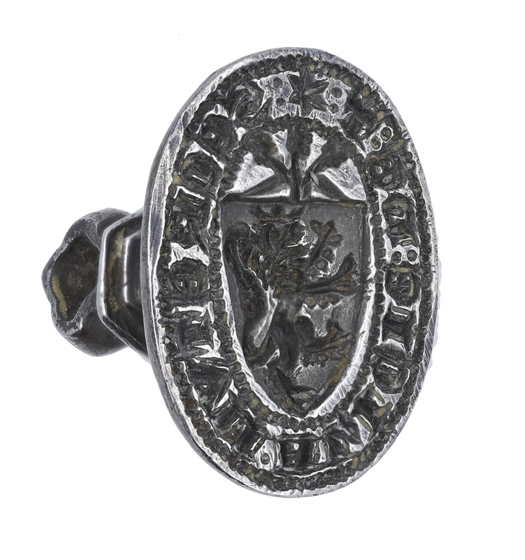 An early 14th century silver oval seal matrix, the hexagonal shaft surmounted by a hexagonal...