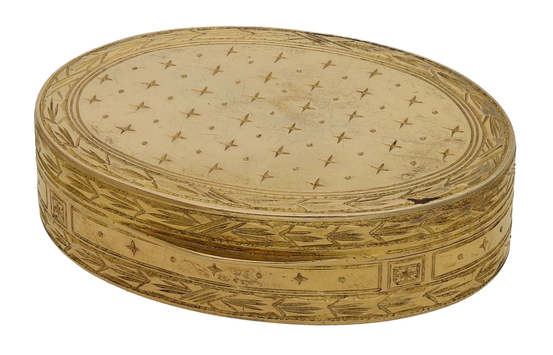 A French 19th century silver gilt oval snuff box, engine-turned with repeating spaced star m...