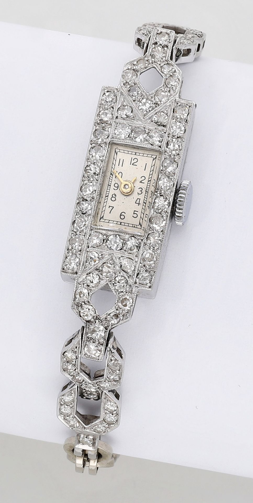 Swiss. A lady's platinum and diamond-set Art Deco cocktail watch, circa 1930. Movement: man...