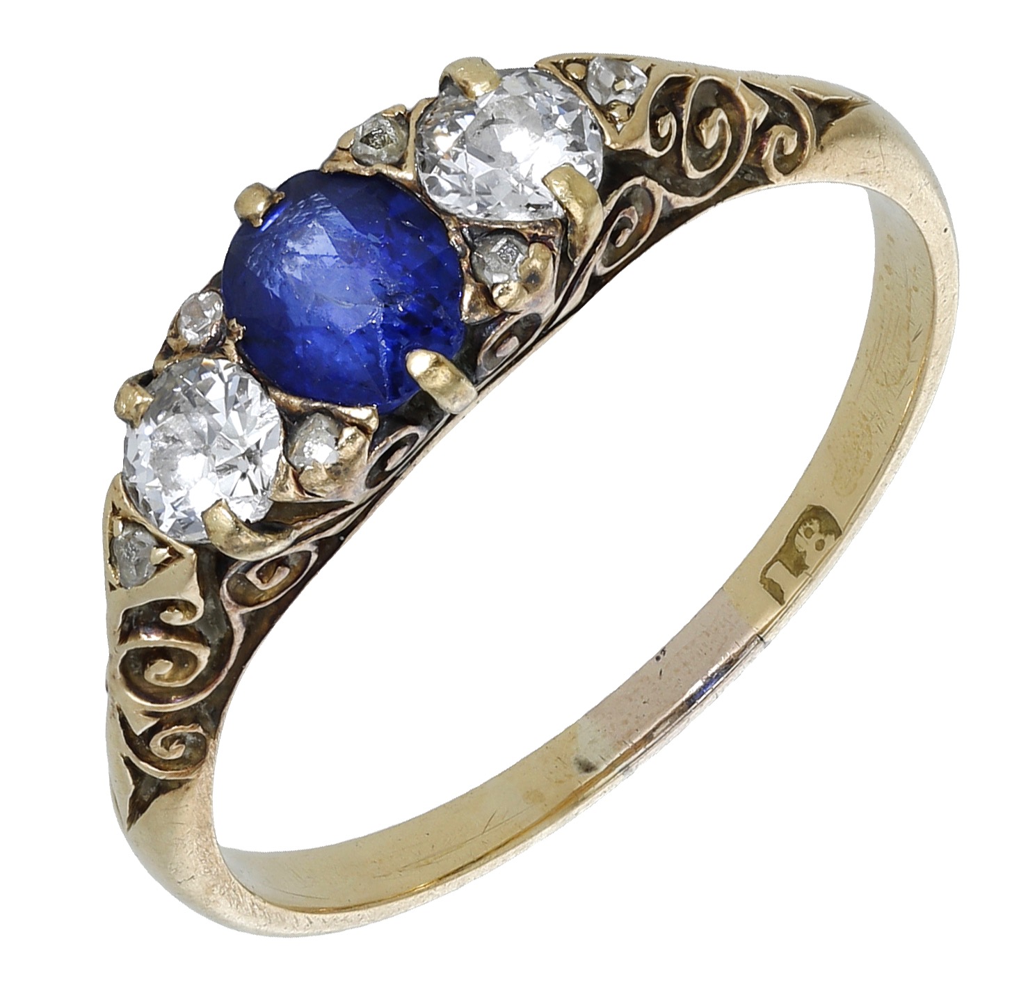 A late 19th century sapphire and diamond three stone ring, the oval-cut sapphire between two...