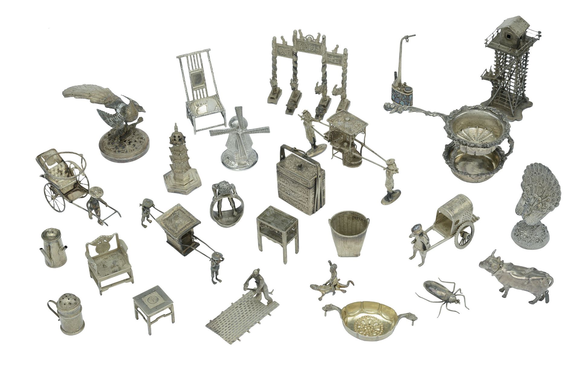 A collection of silver and white metal miniatures, mainly Chinese, to include a watchtower,...