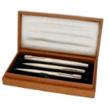 A 9ct gold Parker 61 Presidential Triple set, of waterdrop design, comprising fountain pen,...