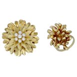 A cultured pearl set flower brooch and a dress ring, the brooch with Florentine finish and c...