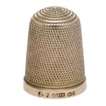 A 9ct gold thimble, of traditional form, by maker J. F, Birmingham 1895, cased. Â£80-Â£100