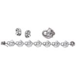A Danish silver tulip suite by Georg Jensen, the bracelet comprised of stylised tulip links,...