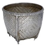 An Eastern bowl, probably Burmese, formed from four basketweave panels, the divisions and fo...