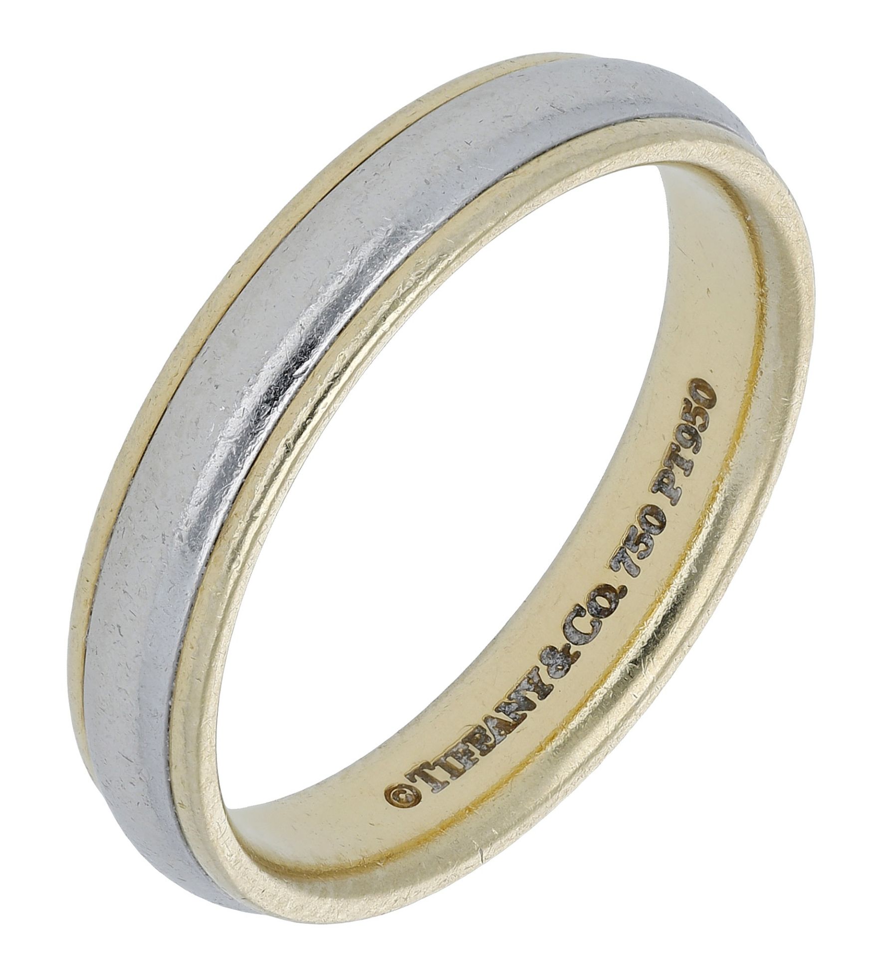 An 18ct gold and platinum ring by Tiffany & Co., the bicolour band with London hallmarks for...