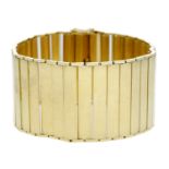 An 18ct gold broad link bracelet, French, composed of articulated polished panel links, Fren...
