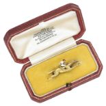 Of racing interest: An early 20th century gold and enamel jockey brooch, retailed by Garrard...