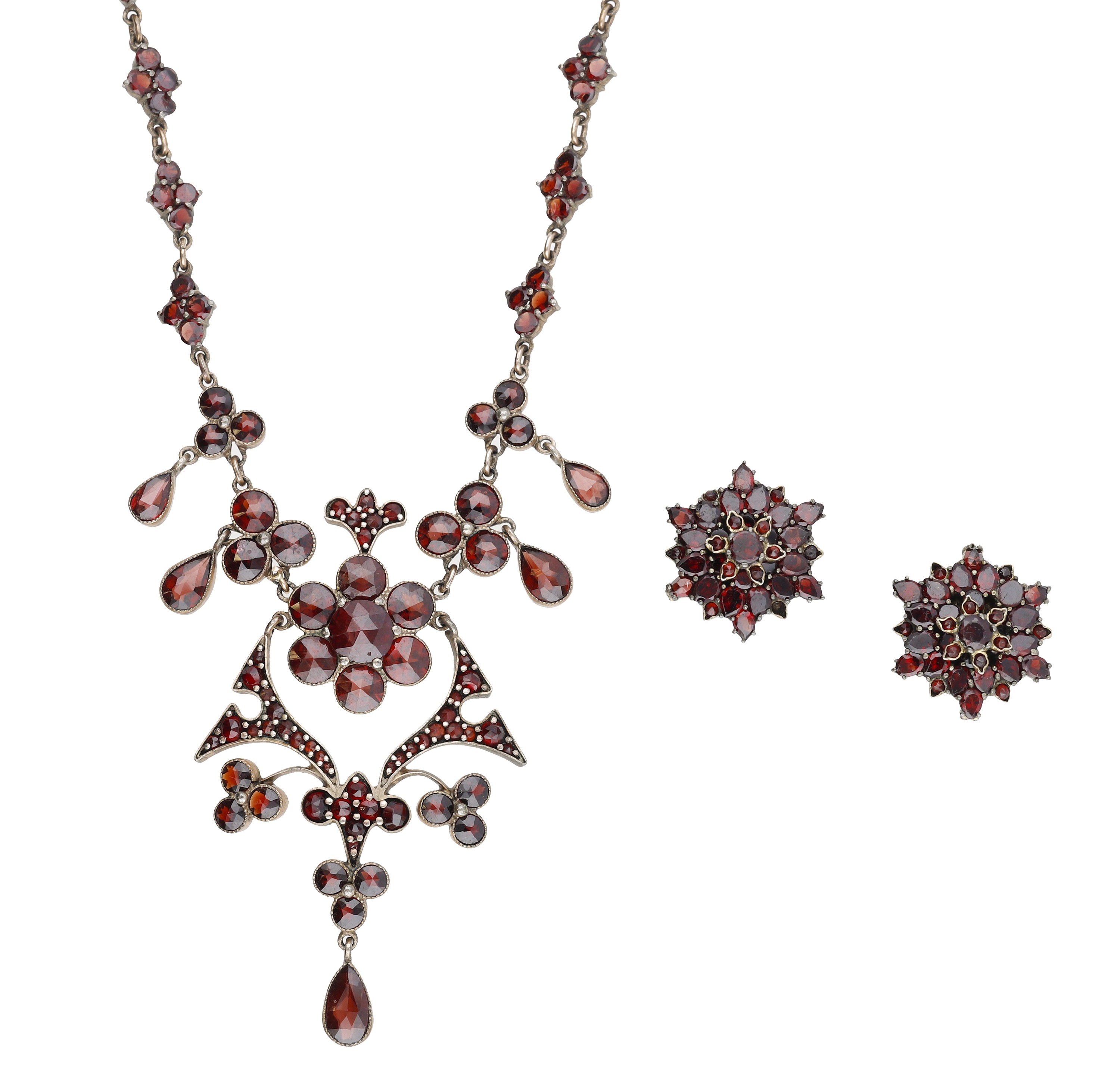 A late 19th century garnet necklace and earring suite, set throughout with vari-cut garnets,...