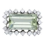 A green beryl and diamond brooch, the rectangular step-cut beryl set within a surround of br...