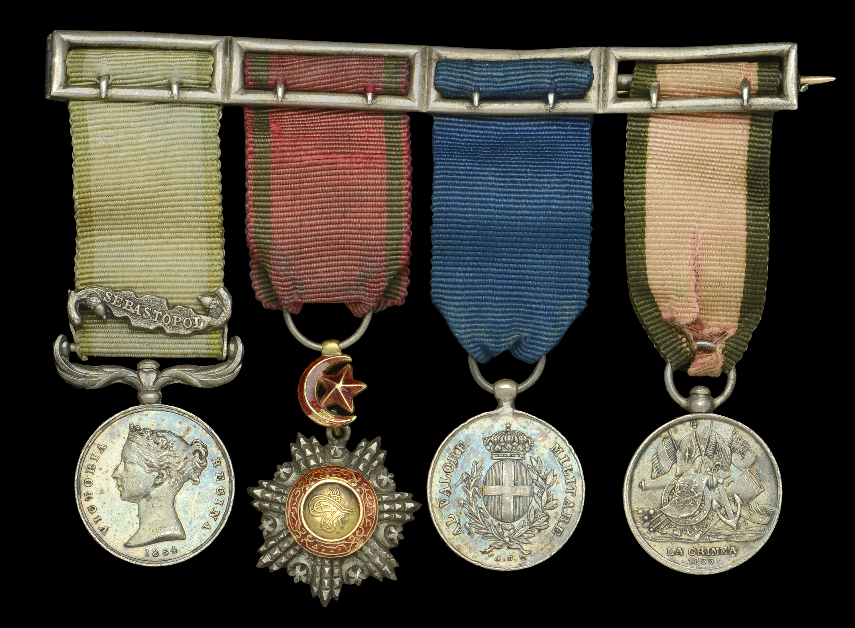 The mounted group of four miniature dress medals attributed to Major E. J. Ward-Ashton, Roya...