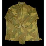 A post Second War Denison smock. A Post Second War Denison smock, green camouflage, with pa...