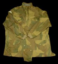 A post Second War Denison smock. A Post Second War Denison smock, green camouflage, with pa...