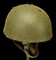 A Korean War period Airborne Paratroopers steel helmet. A Korean War period Airborne Paratr...