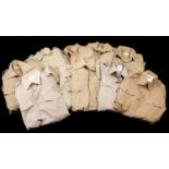 Field Wear. A mixed collection of military clothing comprising 9 khaki shirts, including a...