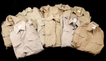 Field Wear. A mixed collection of military clothing comprising 9 khaki shirts, including a...