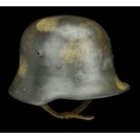 A German Great War Trench Helmet A German M.17 helmet, the skull with a very faint splotch...