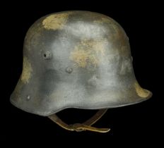 A German Great War Trench Helmet A German M.17 helmet, the skull with a very faint splotch...