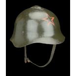 A Russian Second World War Helmet A good and scarce Russian Model 36 helmet complete with a...