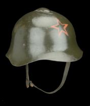 A Russian Second World War Helmet A good and scarce Russian Model 36 helmet complete with a...