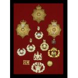 Miscellaneous Cap Badges. A selection of mainly 20th-century Regimental Cap Badges mounted...