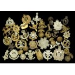 Military Cap Badges. A large selection of military cap badges including Royal West Surrey R...