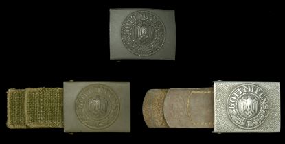 German Second World War Army Buckles. Three buckles, comprising a One-piece stamped steel,...