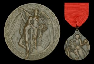 A Carnegie Hero Fund Medallion and Order of Industrial Heroism pair awarded to F. Morgan, fo...