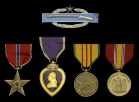 A United States of America 'Vietnam War' Bronze Star and Purple Heart group of four awarded...