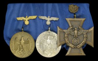An unattributed German Third Reich Customs group of three Armed Forces Long Service Medal...