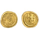 Justin II, Solidus, Constantinople, first officina, crowned bust facing, holding globe surmo...