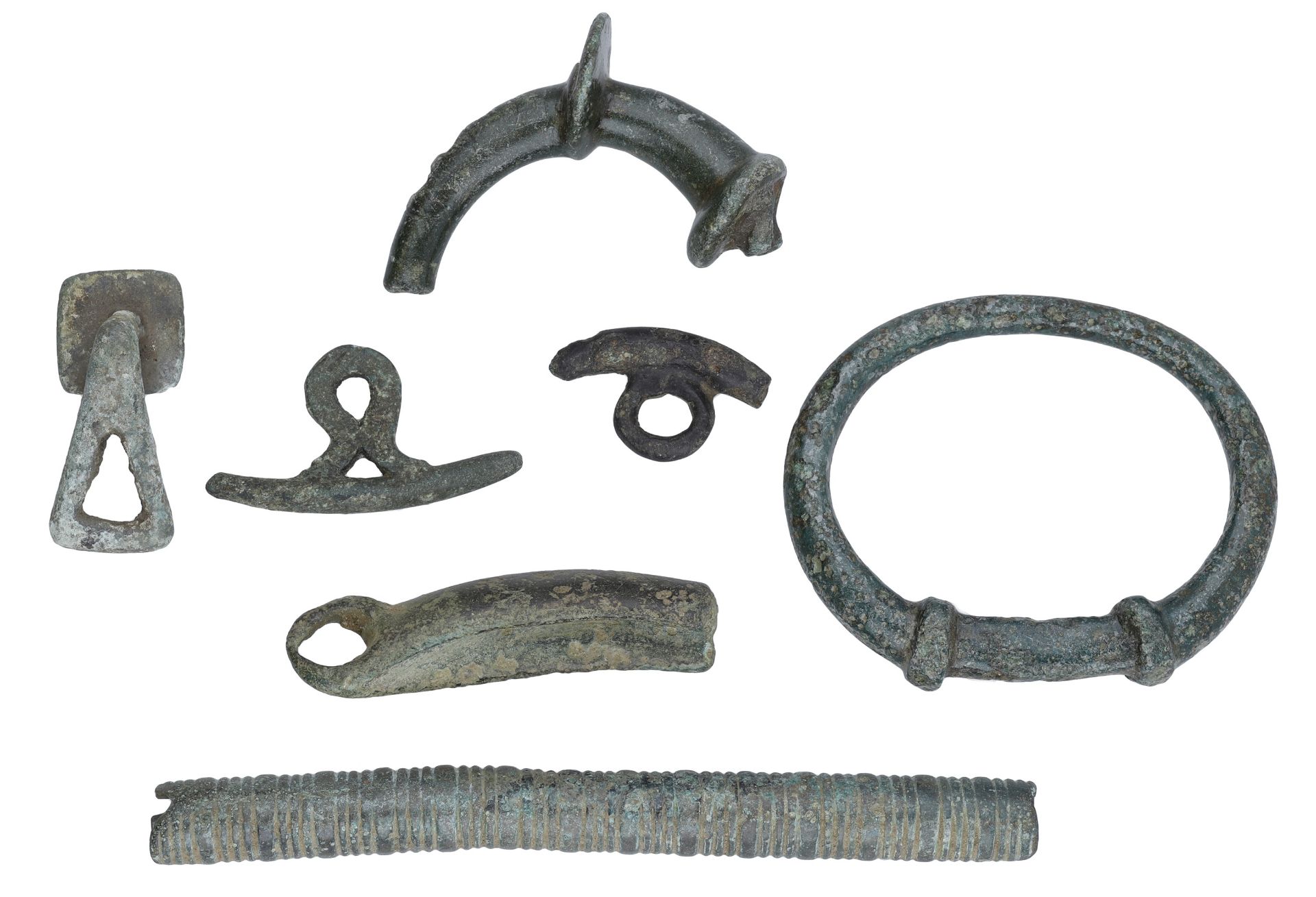 Celtic, miscellaneous bronze artefacts (7), 2nd century BC to 1st century AD, including squa...