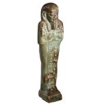Egypt, Ptolemaic Period (305-30 BC), green and brown glazed faience shabti, standing on a pl...