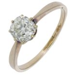 A diamond single stone ring, the old cushion-cut diamond between tapered shoulders, London h...