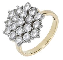 An 18ct gold diamond cluster ring, 1983, of slightly tiered form, the hexagonal-shaped clust...