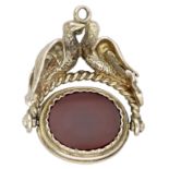 A cast gold swivel fob seal, modelled as a pair of doves, the double-sided seal inset with c...