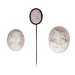 Two unmounted shell cameos and a shell cameo set stickpin, the first carved with the Allegor...