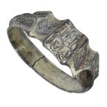 A 15th century silver gilt iconographic ring, the hoop with flat inner section, the moulded...