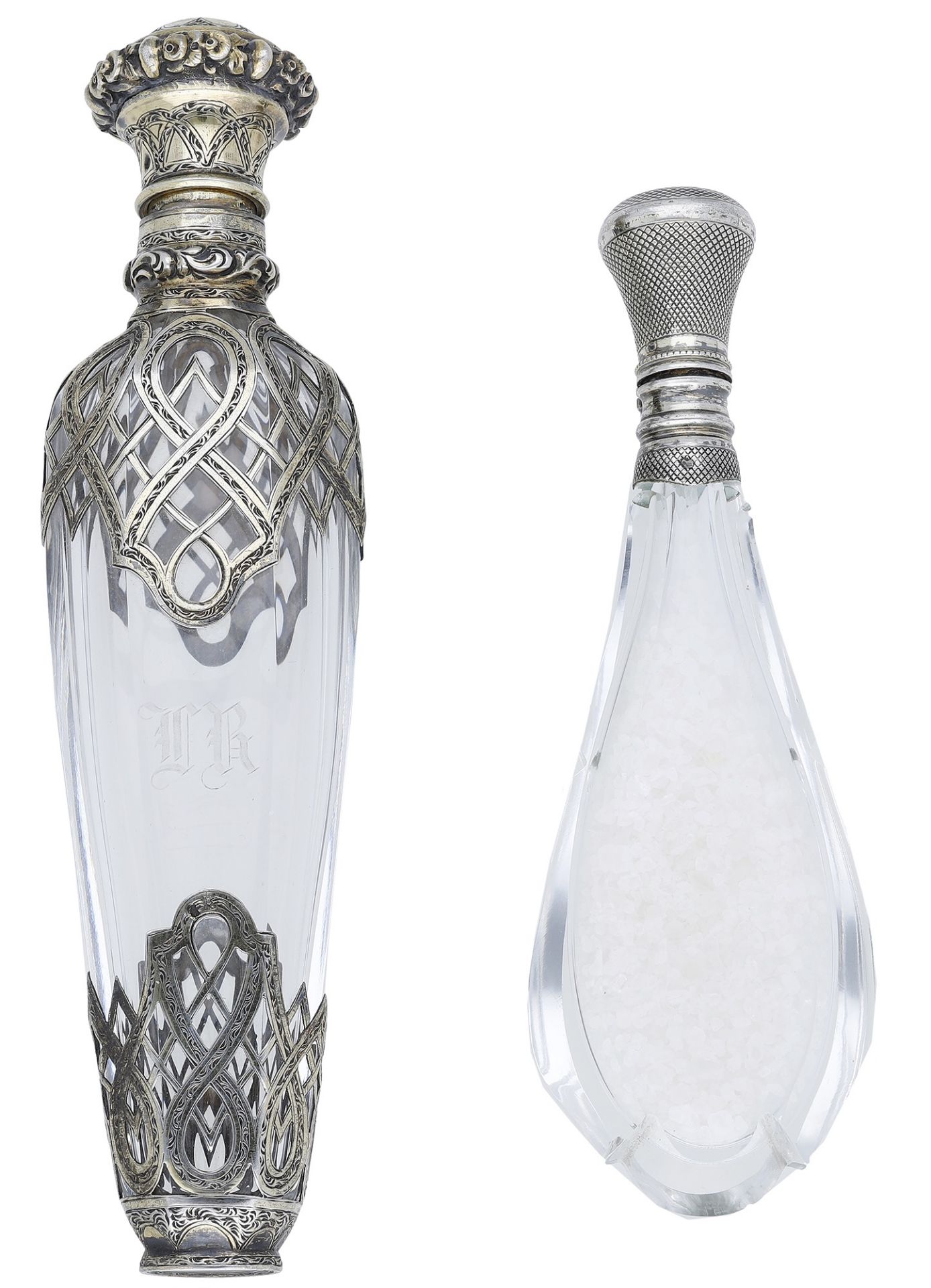 A late 19th century silver-overlaid glass perfume bottle, with pierce-decorated overlay to s...