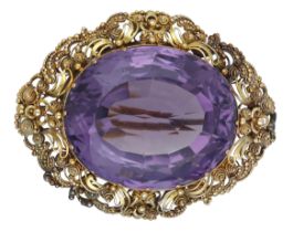 A 19th century amethyst brooch, circa 1830, the oval mixed-cut amethyst within a gold cannet...