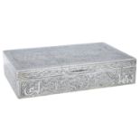 An Egyptian silver cigar box, the lid decorated with stylised flowerheads and foliage within...