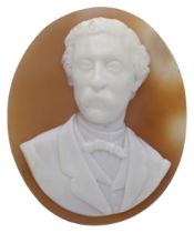 An oval unmounted shell cameo, mid 19th century, probably depicting Robert Louis Stevenson,...