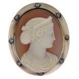 A 19th century hardstone cameo brooch, carved to depict a classical female profile in high r...