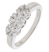 A triple cluster diamond ring, the tiered flowerheads set throughout with brilliant-cut diam...